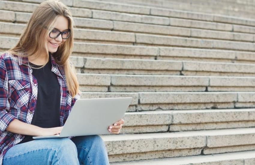 Girl sitting on college steps